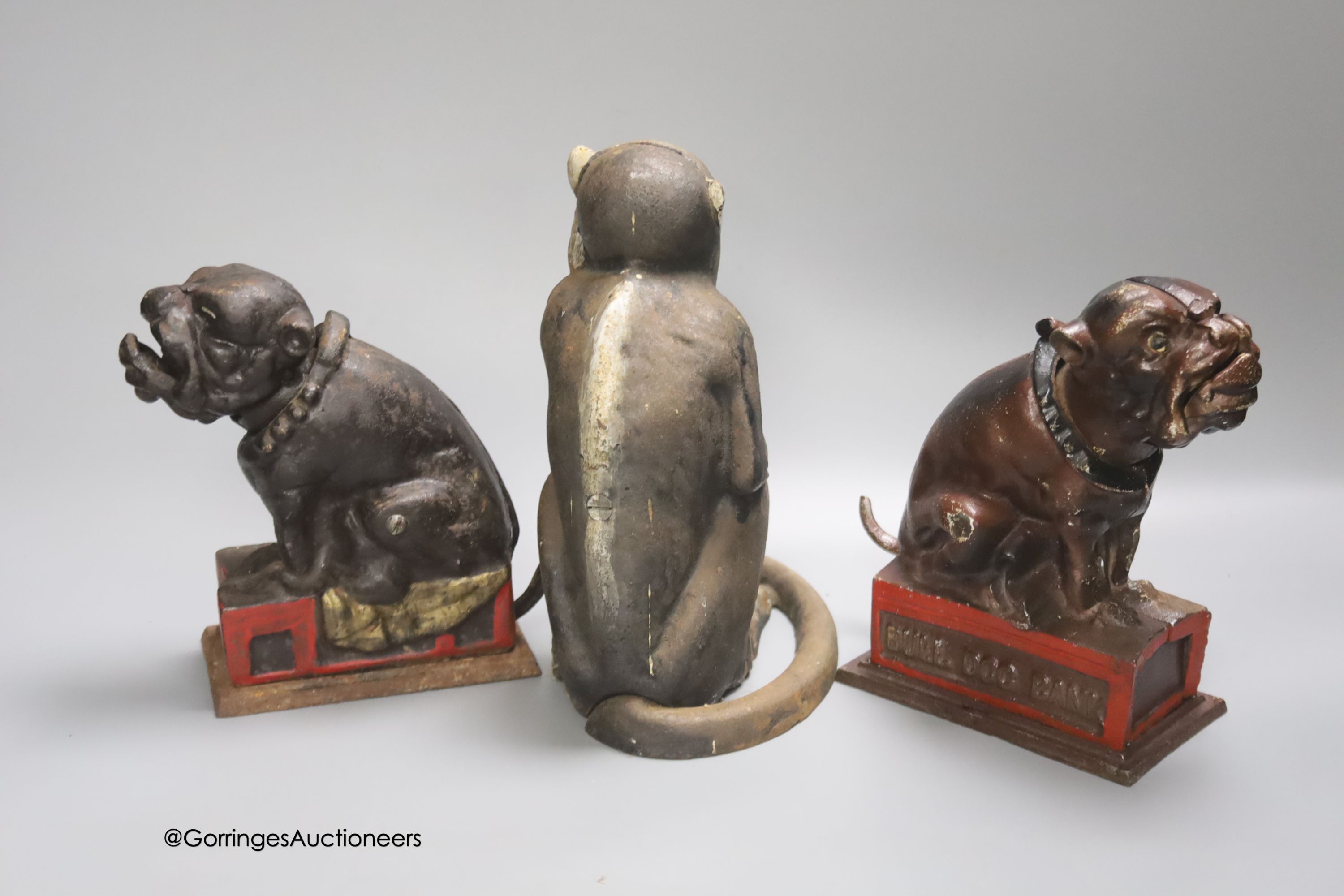 Two cast iron Bull Dog Banks, 16cm, and a cast iron monkey bank